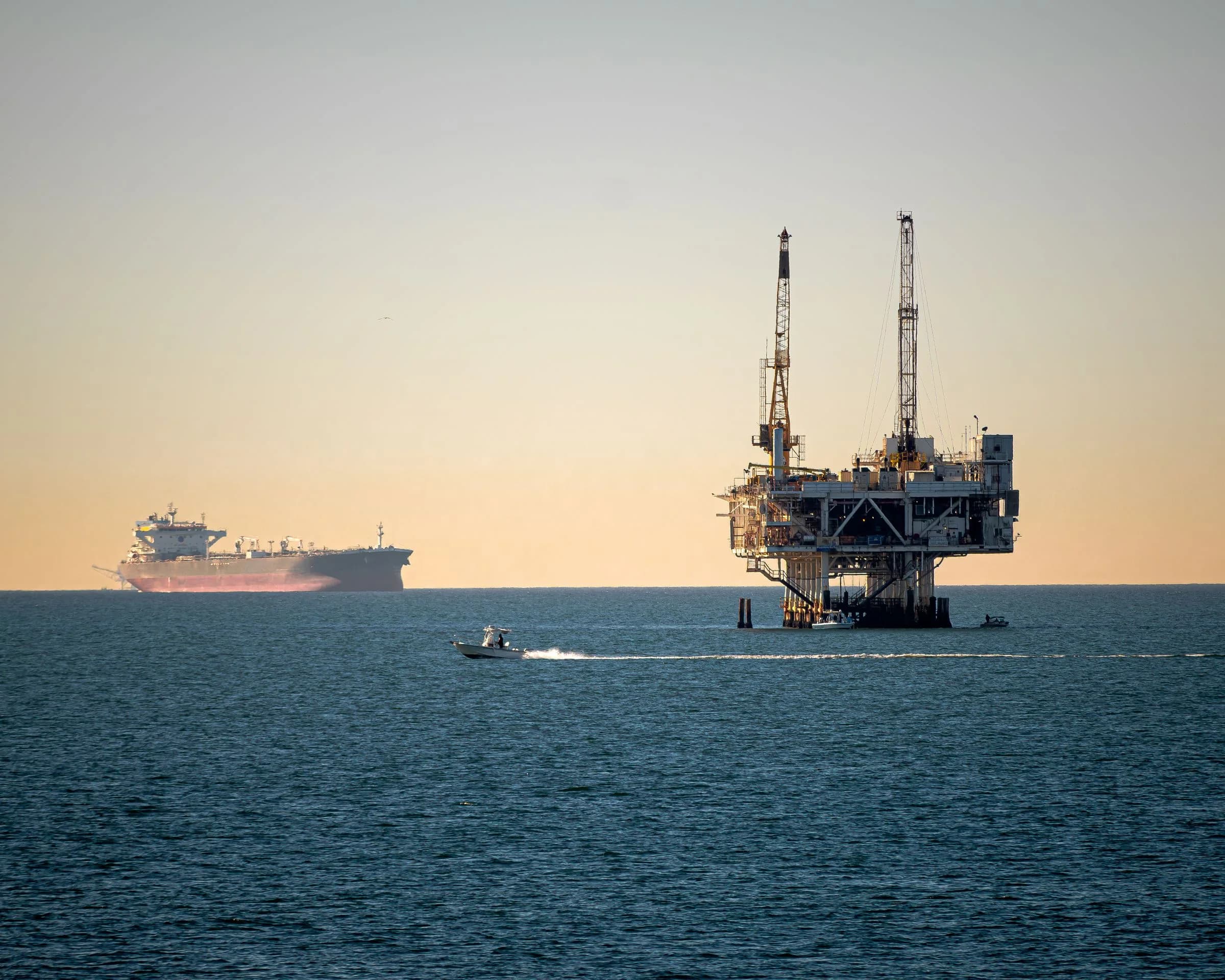 Offshore production platform and support vessel at sea
